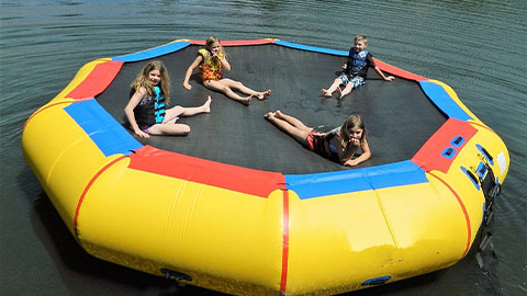 girls on water trampoline