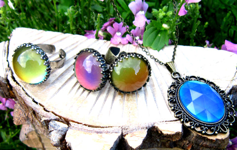 colorful mood rings and a mood pendant in the garden