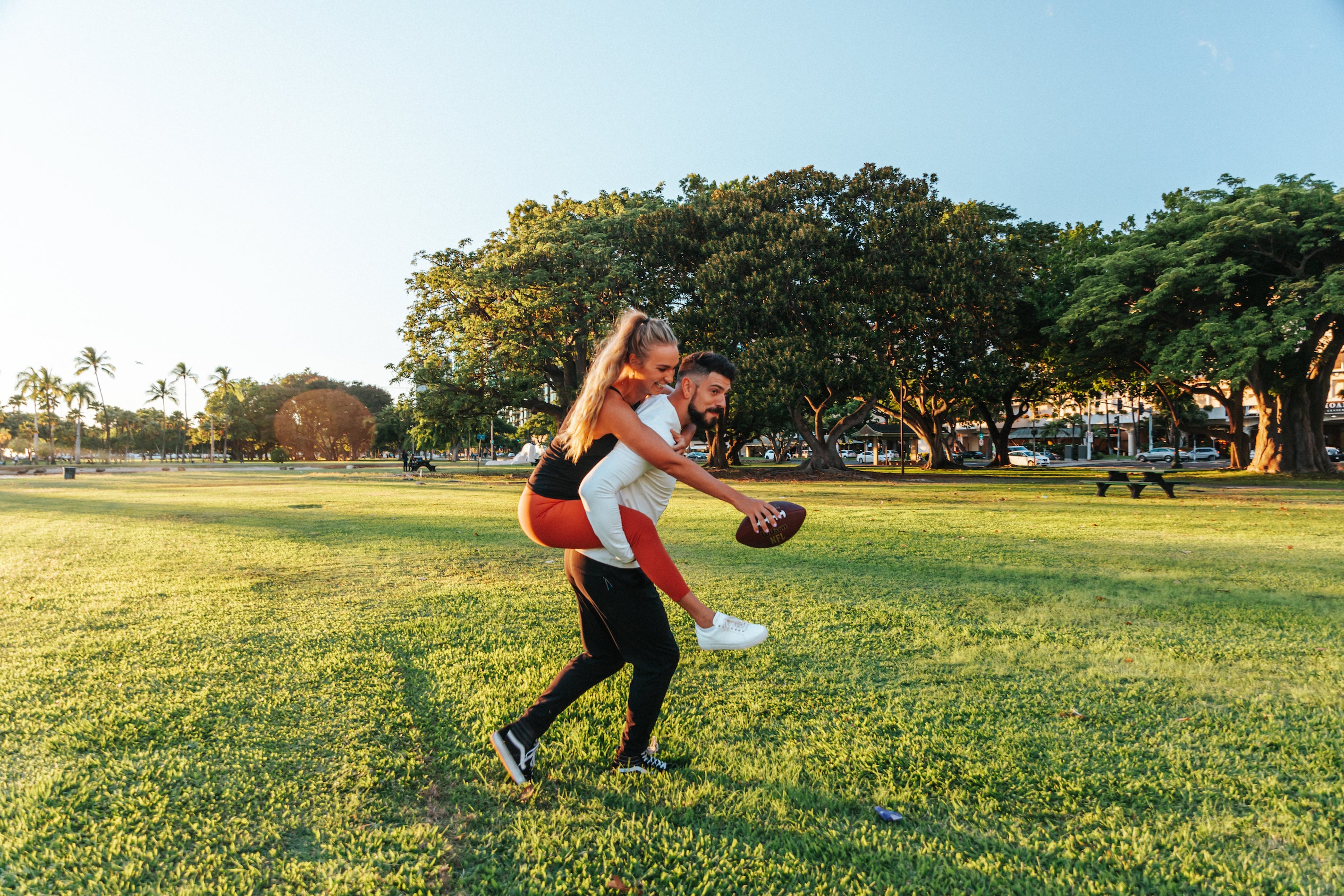 Girl and Guy playing football