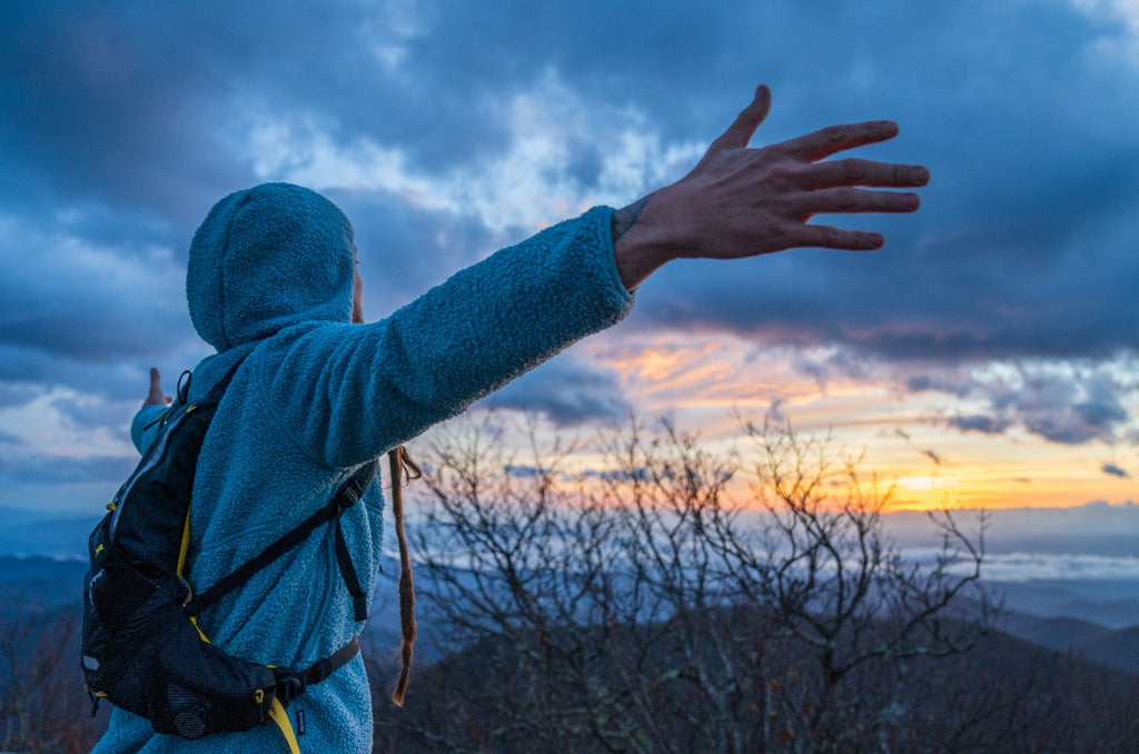 man-celebrating-hiking-view