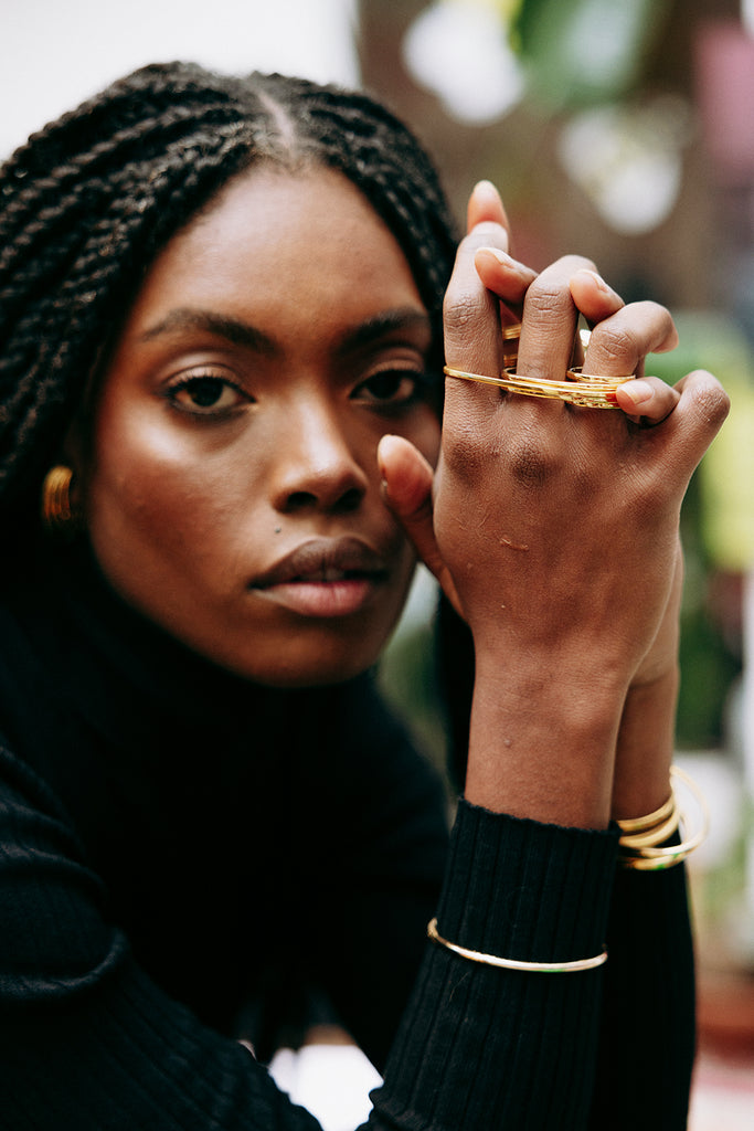 Julia Daka wears the ITO fist ring