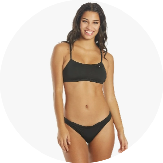 Woman modeling a black two-piece swimsuit with a sporty design. Ideal for competitive swimming and casual beachwear.