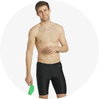 Male swimmer wearing black jammer swim shorts and holding a green swim paddle. Ideal for competitive swimming and training sessions.