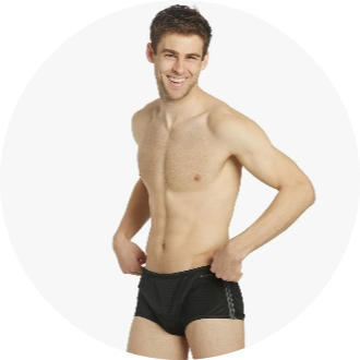 A male model is wearing black swim trunks, showcasing swimwear available in the U.S. Masters Swimming online shop. The trunks feature a sleek design, ideal for competitive or recreational swimming.