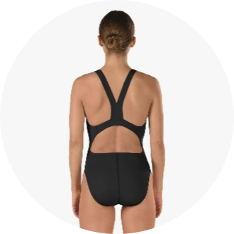 Back view of a woman wearing a black one-piece swimsuit with a racerback design. The swimsuit features a cutout back for enhanced mobility and style, suitable for competitive swimming.
