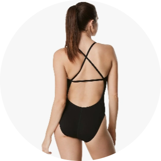Woman wearing a black one-piece swimsuit with a crisscross back design. The swimsuit is ideal for competitive swimming and training sessions.