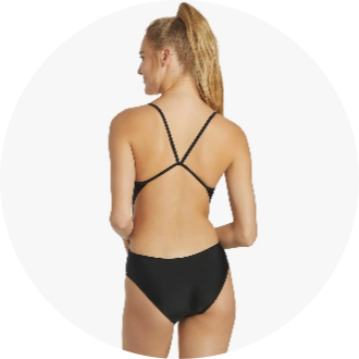 Woman wearing a black one-piece swimsuit with a crisscross back design, ideal for competitive swimming. The suit features a sleek, minimalist style for optimal performance in the water.