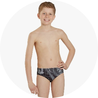 Boy wearing black and white patterned swim briefs, ideal for youth swim training and competitions. The swimwear features a comfortable fit and durable material, perfect for active swimmers.