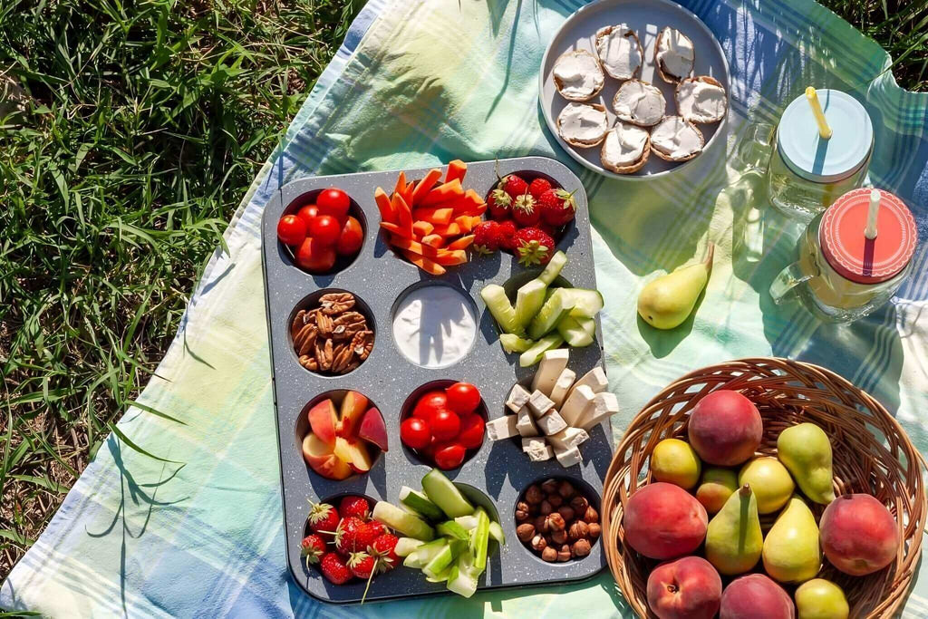 Healthy aperitif in summer fresh vegetable nuts fruit water flavored peach strawberry picnic.jpg