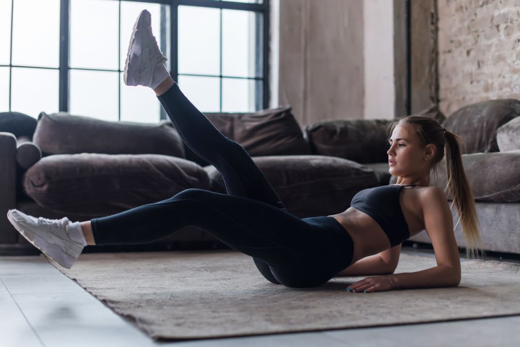 Woman doing sit-ups for a flat stomach