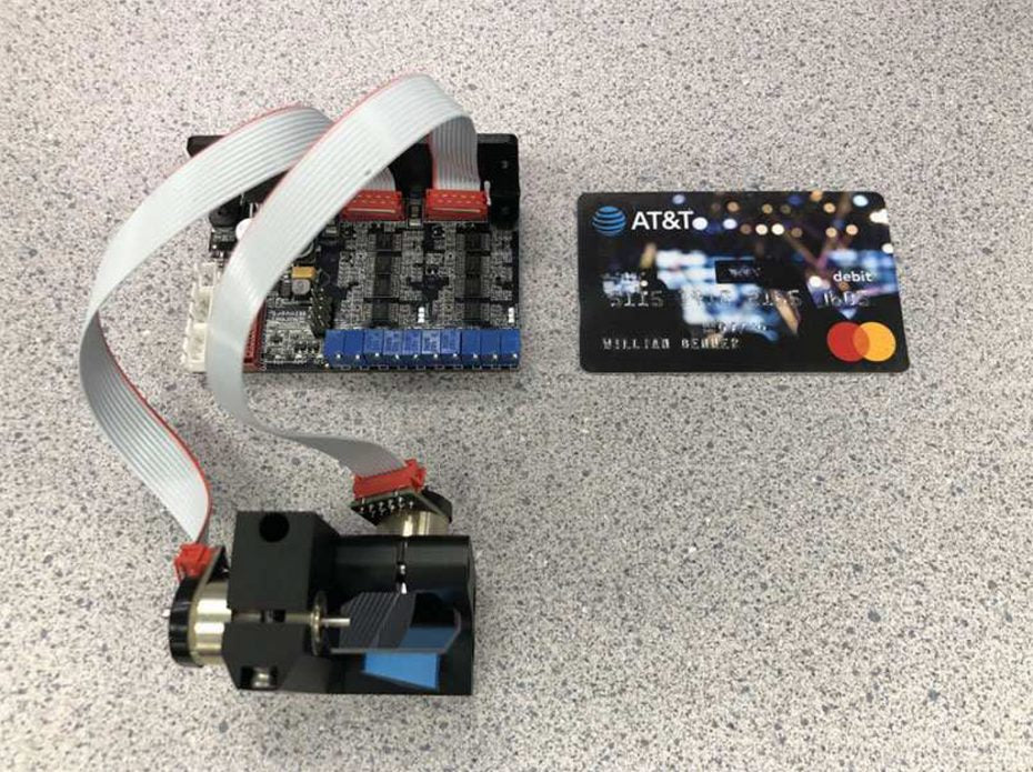 Scanner and driver compared to a credit card