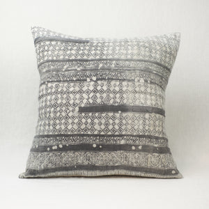 The Mila Hmong Pillow in a grey and white batik pattern. 24" square with natural linen-blend back.