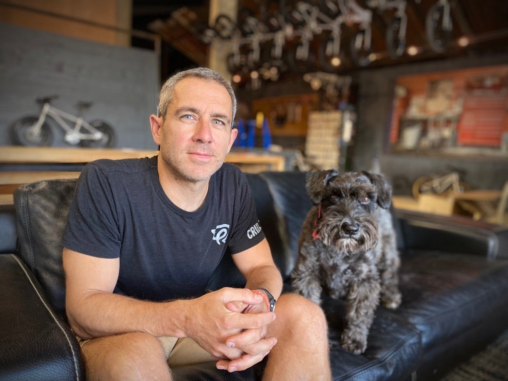 Man and dog sitting on a sofa