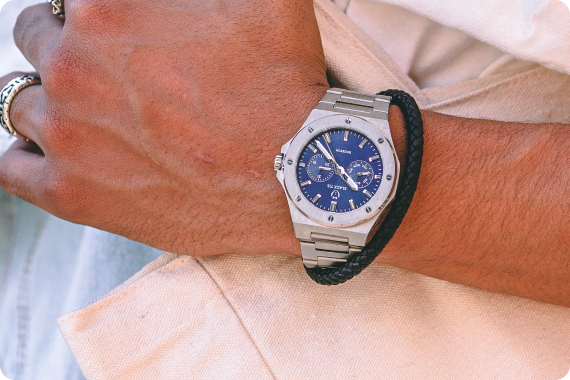 Blue dial watch with black bracelet