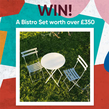 Two bistro chairs and a table with WIN! flashing above it.