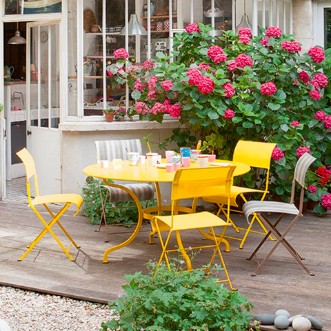 A yellow table and chair set