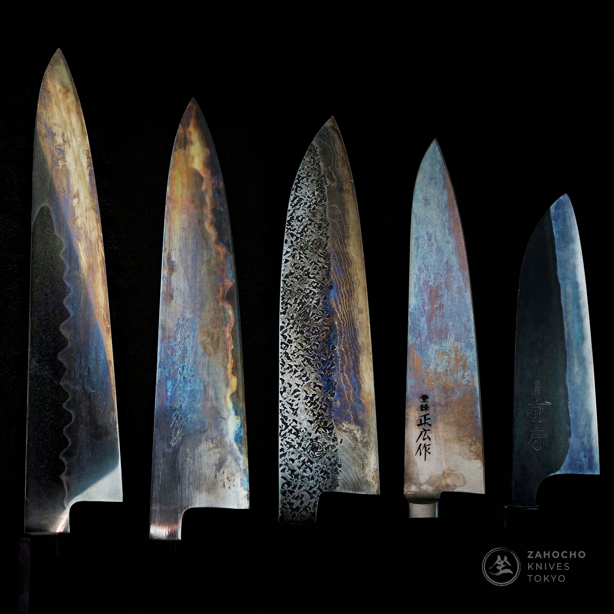 patina on various Japanese carbon steel knives namely ashi honyaki gyuto, yoshikazu tanaka aogami super, and shigefusa