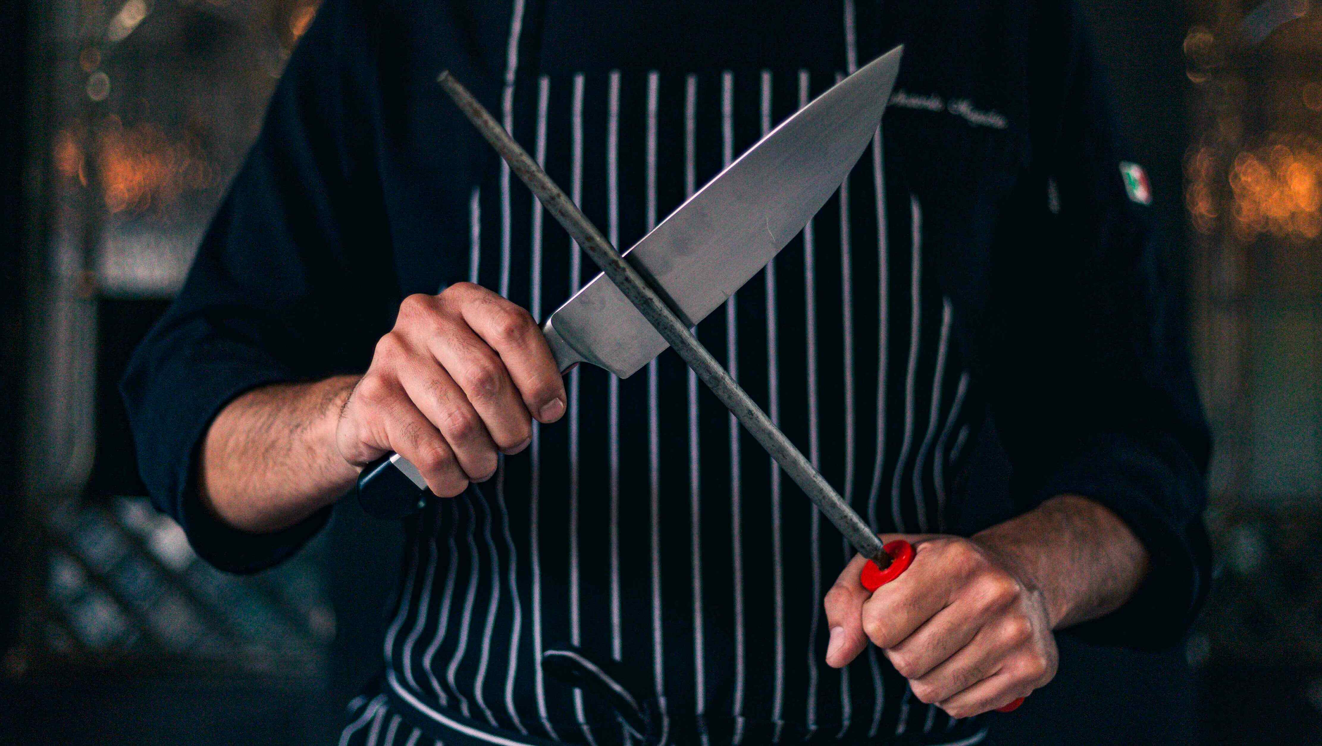 using a honing rod on a western chef's knife for maintenance
