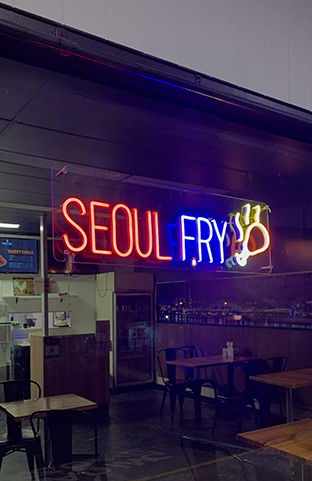 Red, blue, and yellow custom LED neon sign made for a Korean restaurant in Perth. This vibrant neon sign enhances the restaurant's ambiance and adds a unique touch to the dining experience.