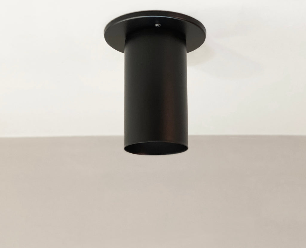 black cylinder flush mount light