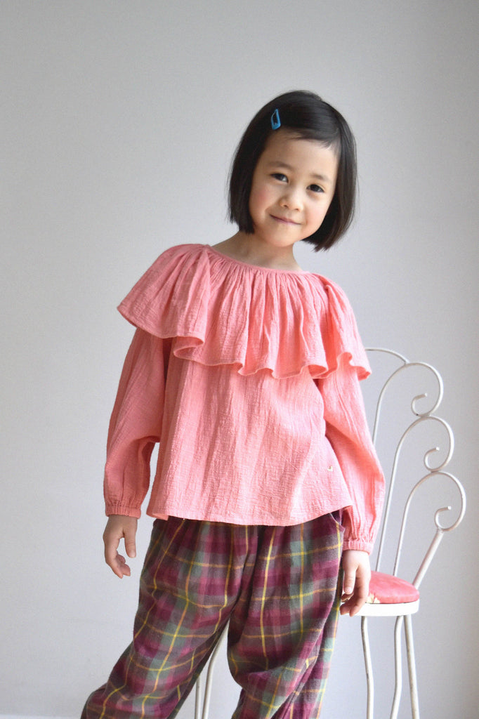 lulaland Fall No.15 Mirage collection. Girl wearing a pink blouse with collar and plaid pants. Organic girl's clothes