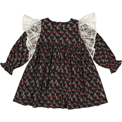 Girls clothes. Black party dress with printed feathers flowers and lace ruffles along the sleeves