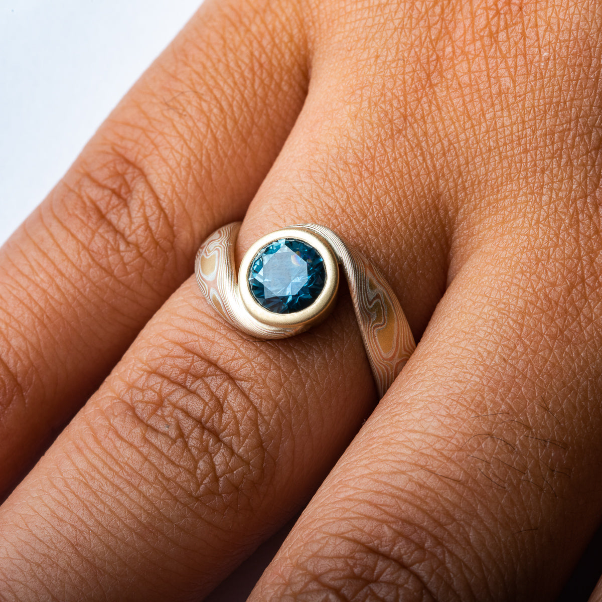 Bypass Style Ring in Woodgrain Pattern and Fire Palette with Blue Sapphire