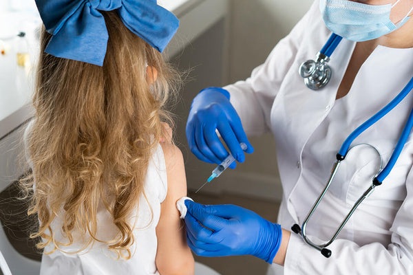 little girl getting vaccinated