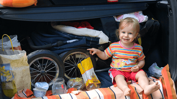 Girl in a fully packed trunk