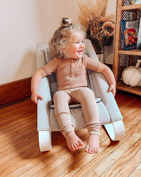 Toddler relaxing on Bamboo Bouncer