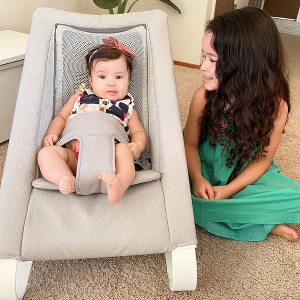 Big sister watching baby in Bamboo 3DKnit Bounccer