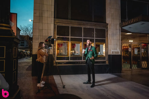 Michael Armanno, Principal Designer at Kalypso Couture, interviewing with First Coast News during the Spring Fashion Show at Art Walk in Downtown Jacksonville. "Best Tailor" Jacksonville