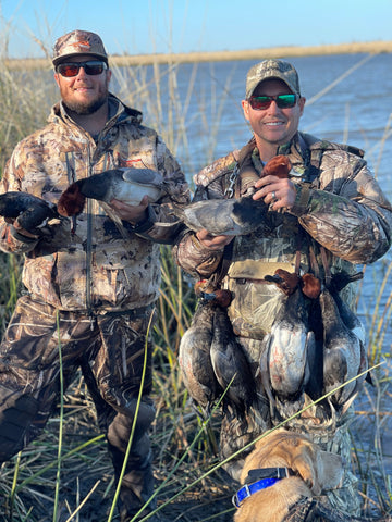 Two of our Florida Panhandle Duck Hunting Guides showing their catch of the day