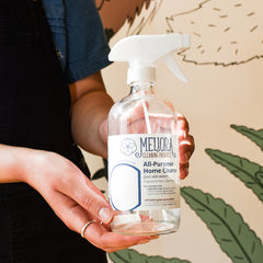 Hands holding bottle of All purpose cleaning tablet for zero waste cleaning