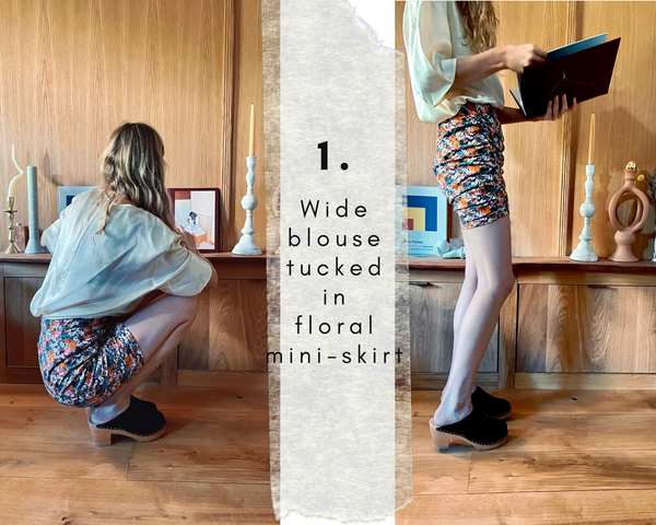 Blond woman wearing a skirt, a blouse and a pair of clogs inside her home