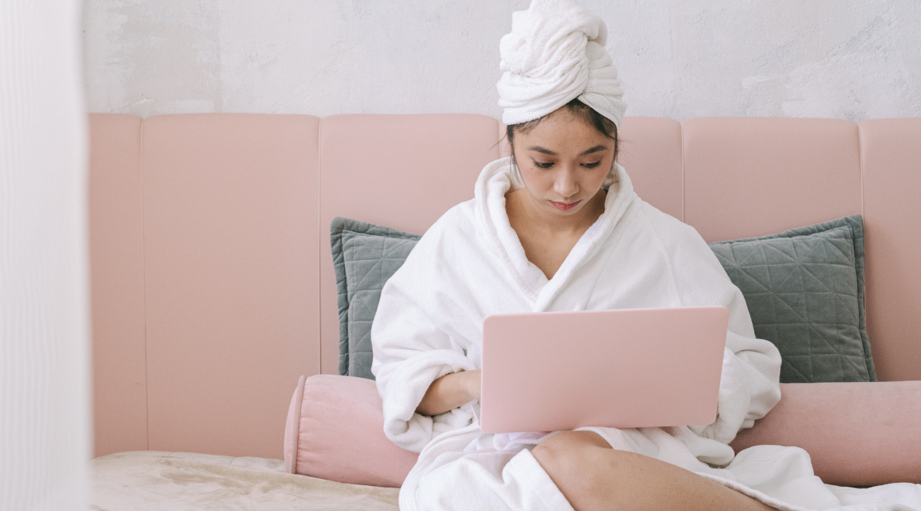 Woman on the couch doing research for her next interview in the beauty industry.