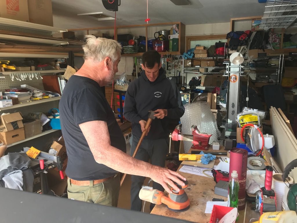 Povey family working on tools in the garage. 