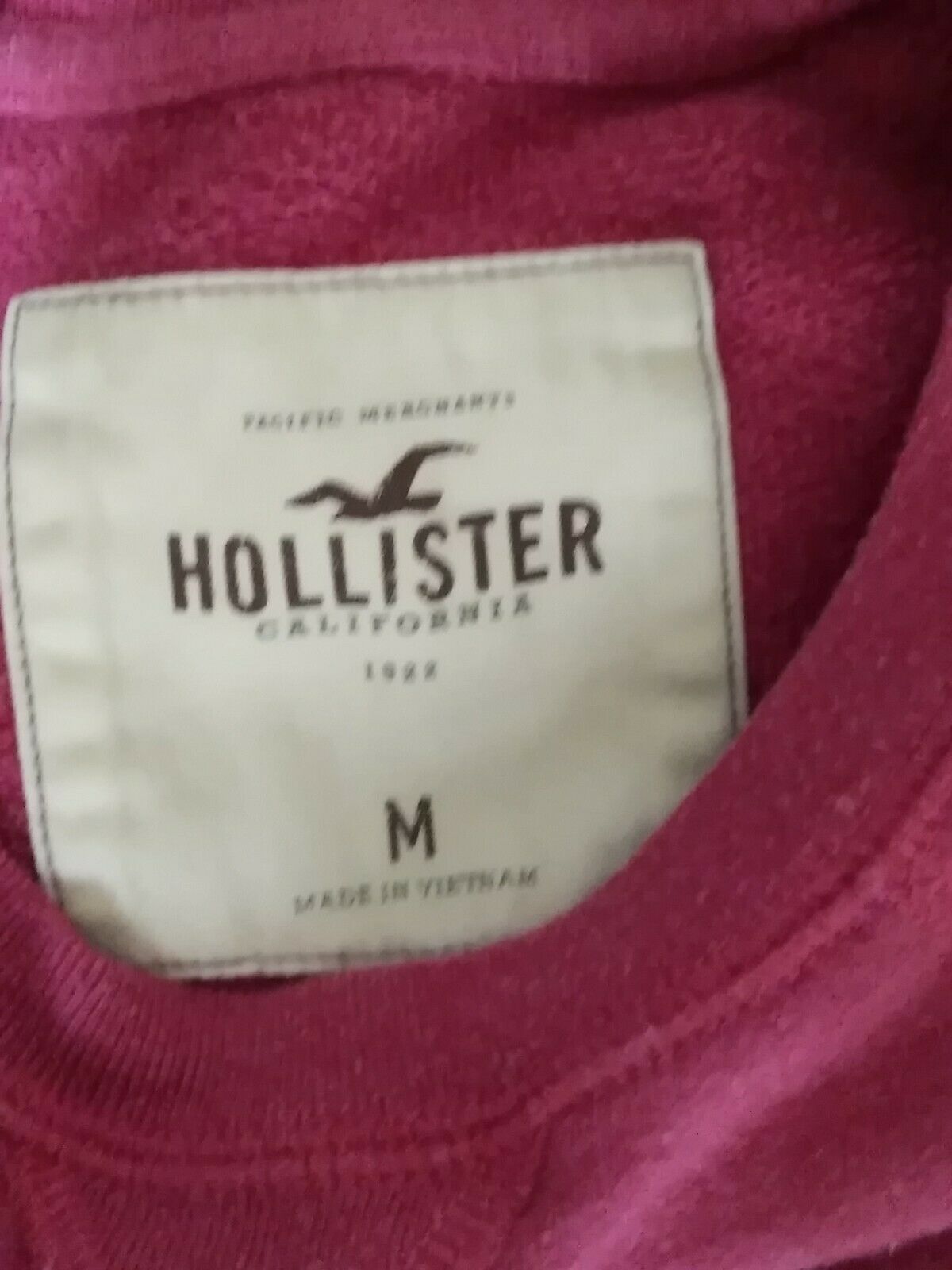 pink and white hollister hoodie