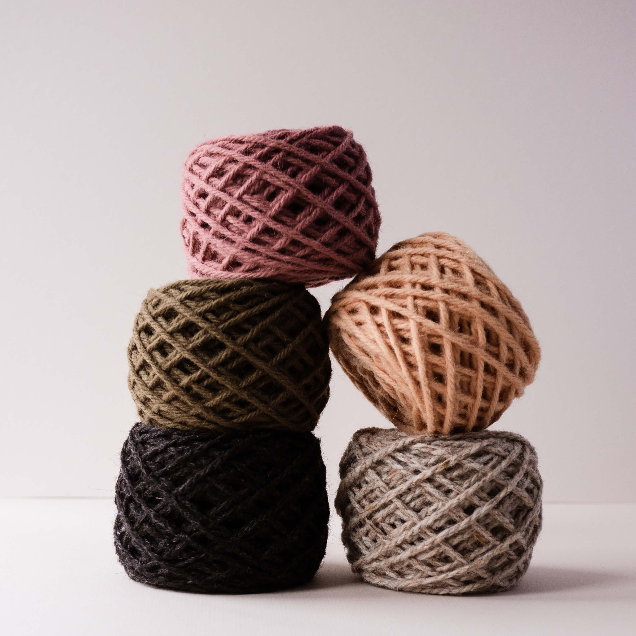 Stack of rug yarn in balls piled up