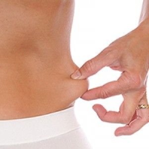 woman pinching her love handles