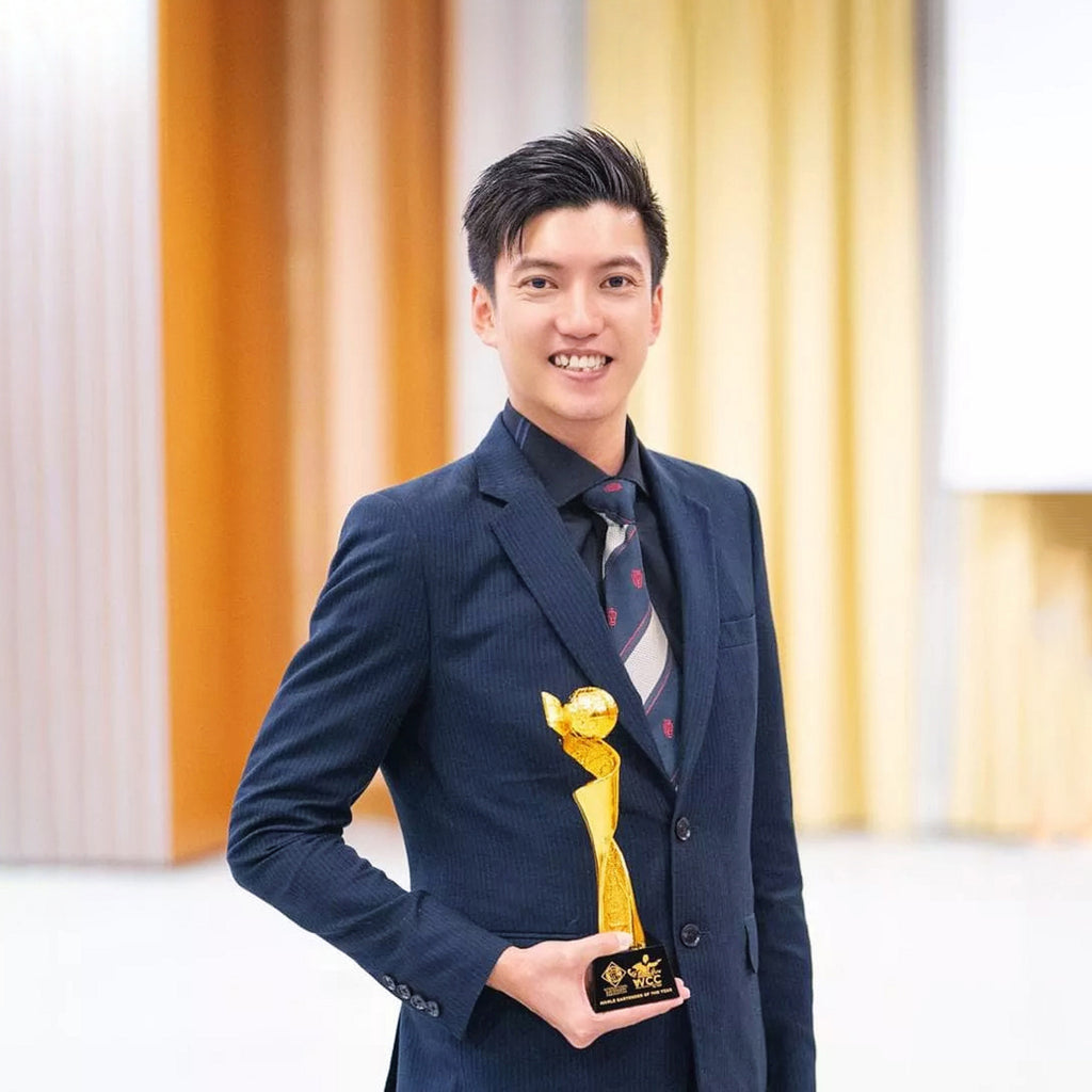 Leo holding a trophy