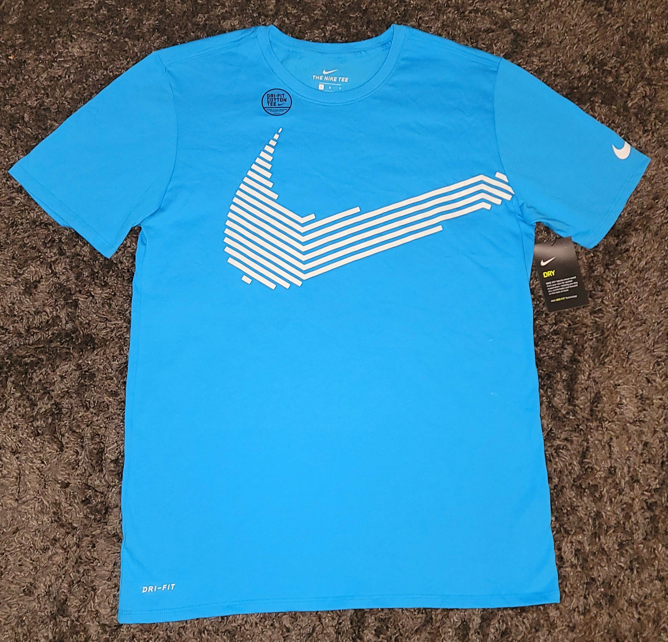 white and baby blue nike shirt