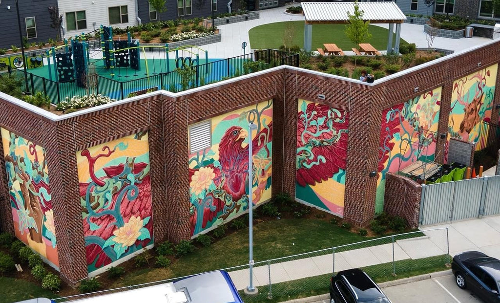 Photo of a 6-panel mural on the side of an apartment building.