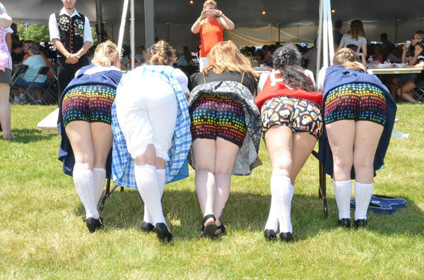 group of woman showing off their adorable bloomers under their dirndls