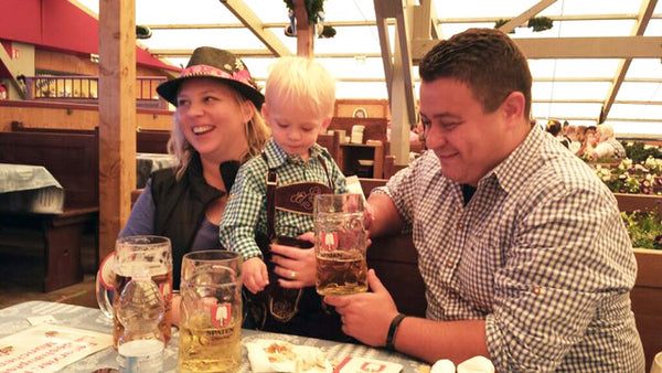 woman wearing a german hat at oktoberfest instead of a maternity dirndl