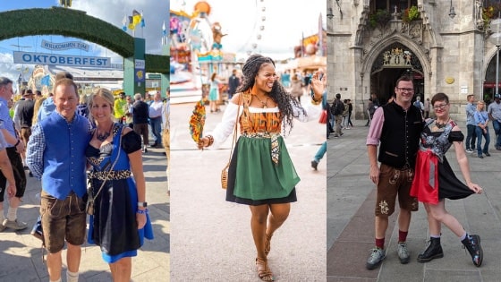 Different people in traditional bavarian outfits like dirndl dresses and lederhosens at a folk festival