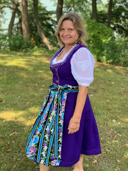 woman wearing clothes from germany - dirndl dress plus size