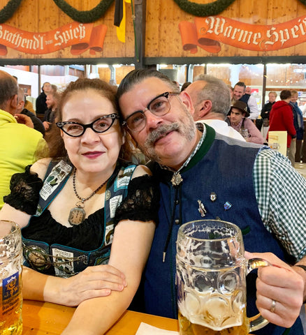 Maria and her husband troy smiling in an oktoberfest beer tent at oktoberfest in munich germany