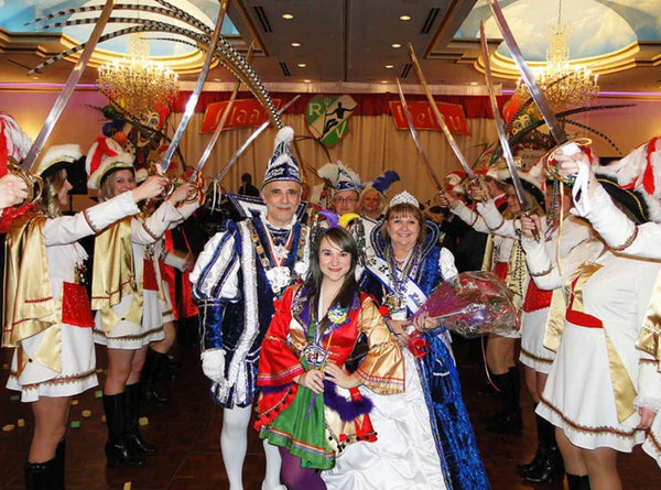 the chicago prinzenpaar walking through a sea of people at a fasching celebration