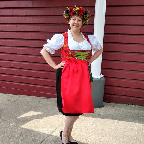 Woman in red and black dirndl with white blouse